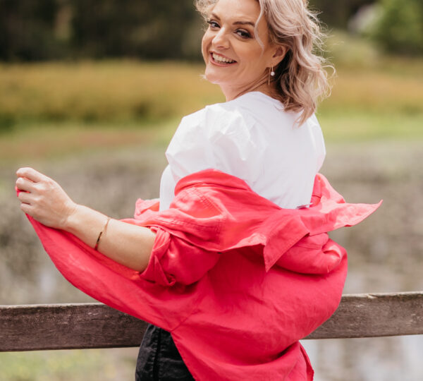 shantelle, wearing red jacket, white shirt, happy